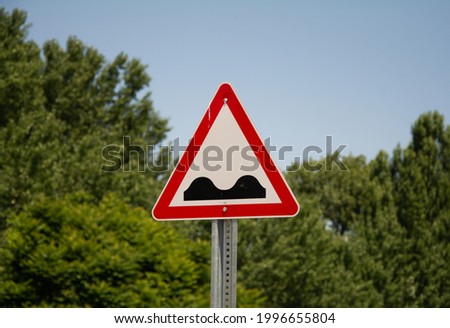 Road bump traffic sign. Red and white traffic sign. car deceleration, driver warning