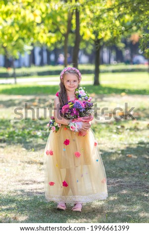 Model in national Ukrainian costume on a sunny day.