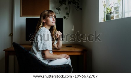 Woman sitting in front of a computer during coronavirus quarantine