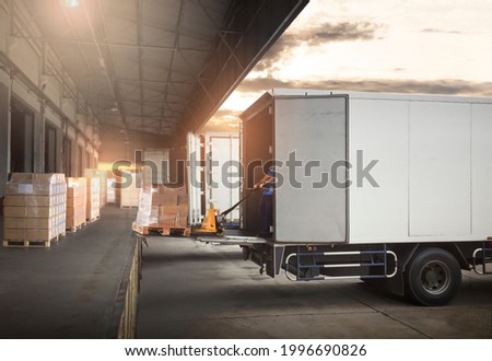 Worker Loading Package Boxes on Pallets into Cargo Container. Trucks Parked Loading at Dock Warehouse. Supply Chain Delivery Service. Shipping Warehouse Logistics. Road Freight Truck Transportation.	
 Royalty-Free Stock Photo #1996690826