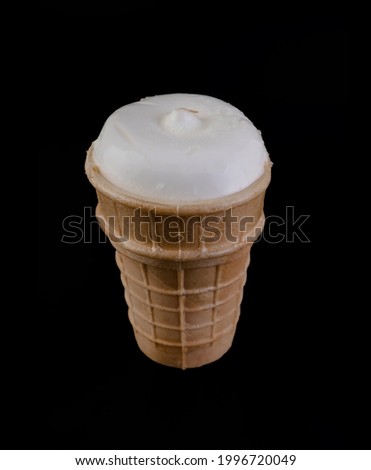 Ice cream in a waffle cup, on a black background