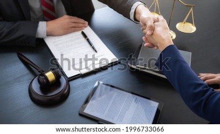 Professional lawyer advising a client on commercial contract legal in service office. Justice, Law, Attorney and Court judge concept. Royalty-Free Stock Photo #1996733066