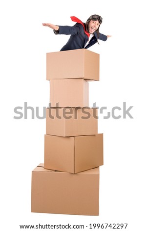 Businessman flying in carboard boxes isolated in white Royalty-Free Stock Photo #1996742297