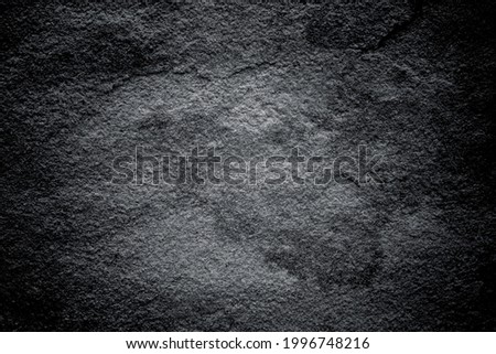 Dark gray stone texture detailed patterns on black background	