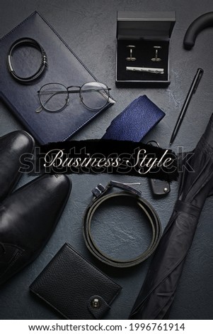 Stylish accessories of businessman on dark background