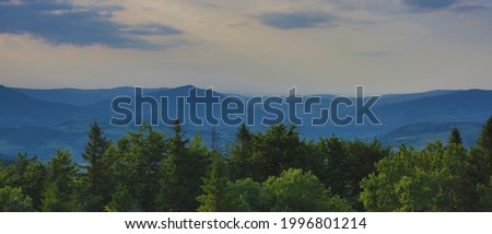 Green hill landscape. Mountain landscape on sunny day. Sunrise mountain scenery. Mountains on the cloudy sky.