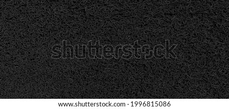 Panorama of Black plastic doormat texture and background seamless