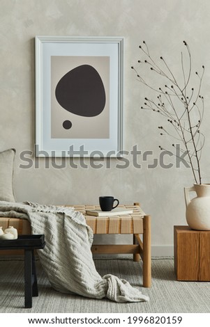 Stylish composition of cozy living room interior with mock up poster frame, pillow and plaid on the chaise longue, dry banch in beige vase on the wooden cube and elegant personal accessories. Template