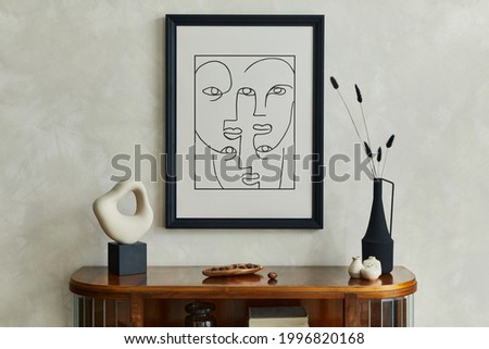 Stylish minimalistic composition of creative living room interior with mock up poster frame, dry flowers in black vase and creative sculpture on the wooden commode and elegant personal accessories.