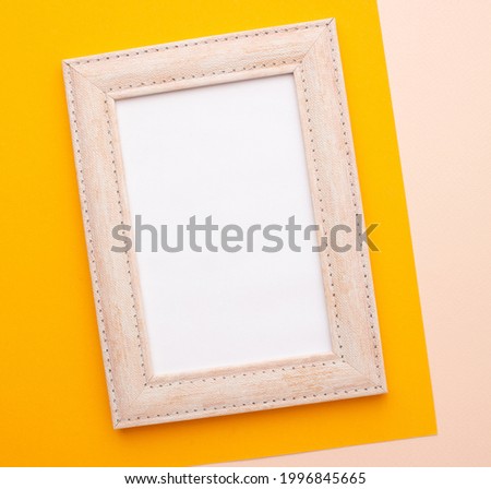 Pink frame on a pink and orange background with a place for an inscription. High quality photo