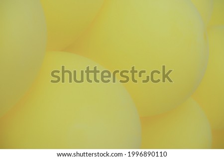Background from yellow balloons. Blurred Photo of balloons for background