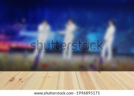 Empty Wood Plate Top Table On Defocused Entertainment Concert Lighting On Stage