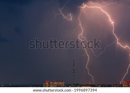 Stunning hurricane thunderstorm with city skyline. Bright lightning against the curtain sky. High quality image with negative space