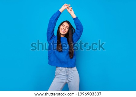 Photo portrait young girl overjoyed dancing wearing casual clothes isolated vibrant blue color background Royalty-Free Stock Photo #1996903337