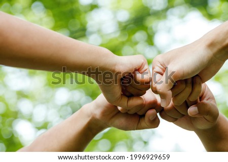 World environment day with global community teamwork,Group of volunteer join hand together concept, Volunteer charity work. People joining for cooperation success.sustainable development goal  Royalty-Free Stock Photo #1996929659