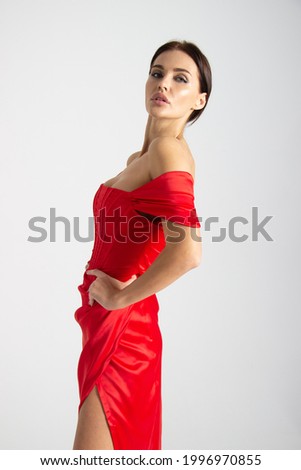 beautiful woman posing in red dress