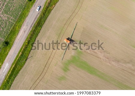 agricultural field, work of agricultural machinery, drone shooting, top view 