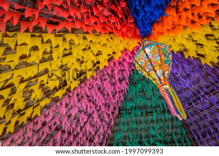 Colorful flags and decorative balloon for the Saint John party, which takes place in June in northeastern Brazil. Royalty-Free Stock Photo #1997099393