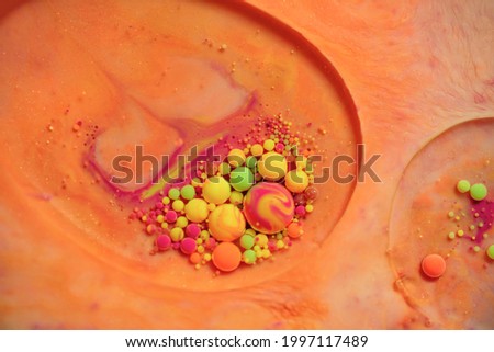 Bright and colorful abstract background from acrylic paints and oil mix, Macro bubble photography for wall art. Acrylic paint and oil mix creating macro bubble. Close up photography
