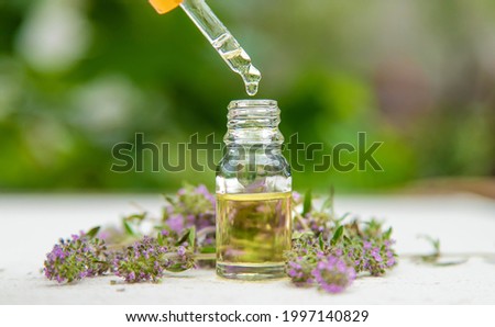 Thyme extract essential oil. Selective focus. nature green. Royalty-Free Stock Photo #1997140829