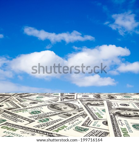 The road out of the dollar in the blue sky with clouds