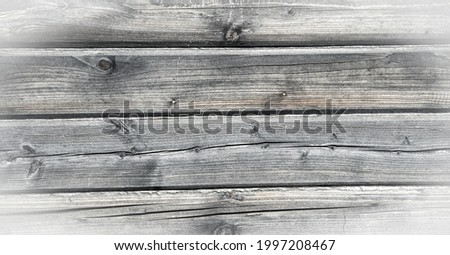 The texture of the old tree, the timber from which the house was built. Deep cracks are visible on the wooden beams. High resolution backgrounds and patterns.