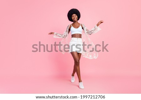 Full size photo of impressed short hairdo millennial lady wear white top cape skirt isolated on pastel pink color background