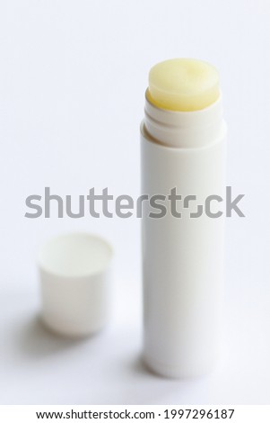 White chapstick. Hygienic lipstick. Lip balm isolated on white background. Royalty-Free Stock Photo #1997296187