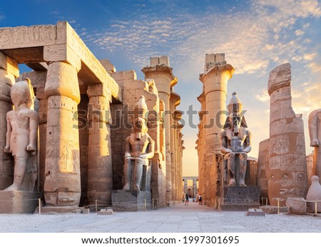 Luxor Temple courtyard and the statues of Ramses II, Egypt Royalty-Free Stock Photo #1997301695