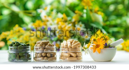 Supplements and vitamins with medicinal herbs. Selective focus. Nature. Royalty-Free Stock Photo #1997308433