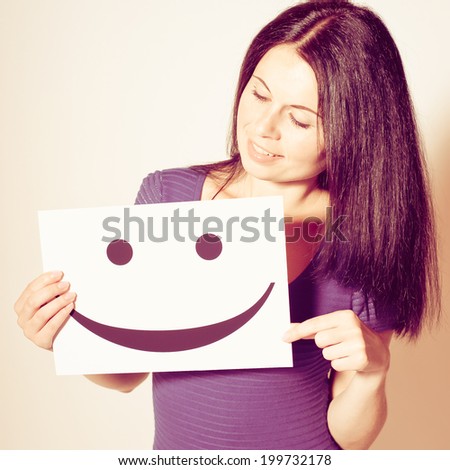 Young Woman holds a smile, studio photo. Photo with instagram style filters