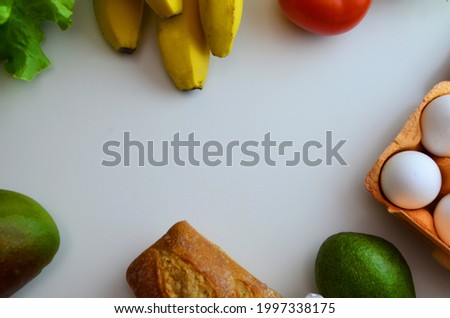 Healthy food background. Healthy vegan vegetarian food in paper bag vegetables and fruits on white, copy space, banner. Shopping food supermarket and clean vegan eating concept.