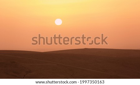 Sunset over the desert in the Judean wilderness, Holy Land Royalty-Free Stock Photo #1997350163