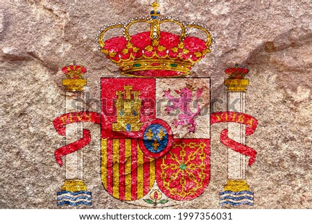 Faded Spain national royal emblem symbol, Coat of arms of Spain isolated on weathered solid rock wall background, abstract positive design faithful Spain politics society culture concept texture