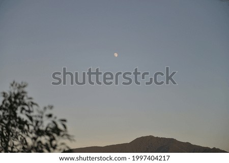 view the moon during camping in the mountain
