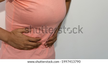 woman with stomach ache medical concept white background health care