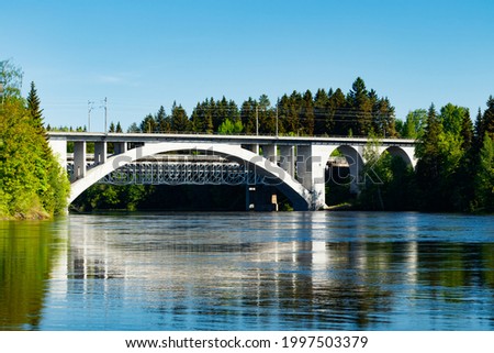 Summer landscape of bridge and Kymijoki river waters in Finland, Kymenlaakso, Kouvola, Koria Royalty-Free Stock Photo #1997503379