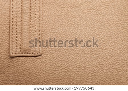 Texture of brown leather with brown stitching. Large resolution.