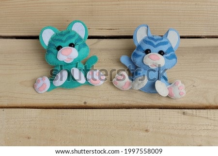 Symbol of 2022. Soft toy tiger isolated on wooden background.
