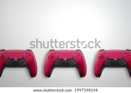 Next Generation red game controller isolated on white background. Top view.