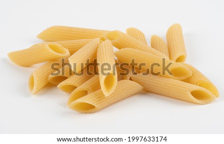 Penne pasta isolated on white Royalty-Free Stock Photo #1997633174