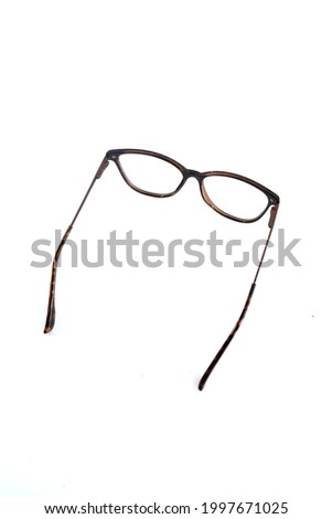 isolation glasses on white background. leopard color cat eye glasses frames. Cat's eye glasses frame in the photo from above on a white background
