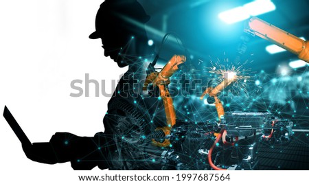 Mechanized industry of future factory double exposure image . Concept of robotics technology for industrial revolution and automated manufacturing process .
