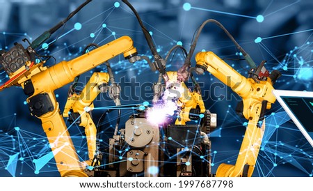 Smart industry robot arms modernization for innovative factory technology . Concept of automation manufacturing process of Industry 4.0 or 4th industrial revolution and IOT software control operation.