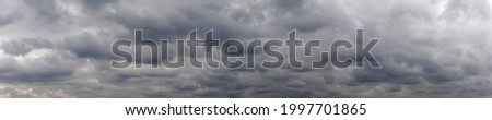 Blue sky with gray clouds at daytime