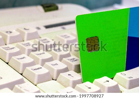 credit bank card on the computer keyboard concept trading online. High quality photo