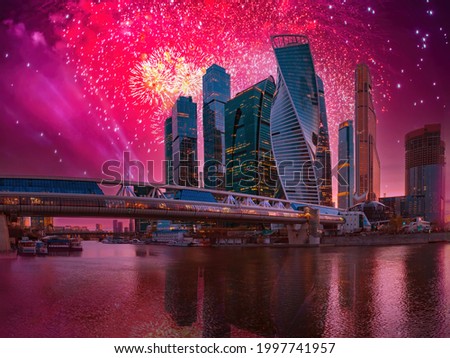 Fireworks in Moscow. Holidays in Russia. Fireworks on background of Moscow city skyscrapers. Festive fireworks over business center of Moscow. Evening city landscape of Russian Federation.