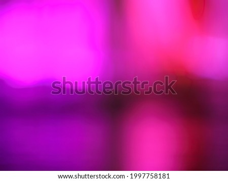 Long exposure photography. Abstract purple light. Playing with neon light beams. Night music fountains in the Moscow public park.  Suitable as beautiful festive bright background. 