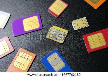 Multiple colorful sim cards used in smartphones
