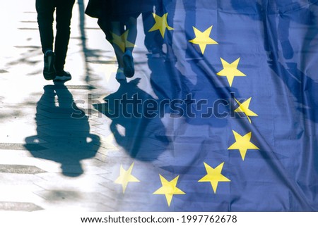 EU or European Union Flag and shadows of people, concept political picture	